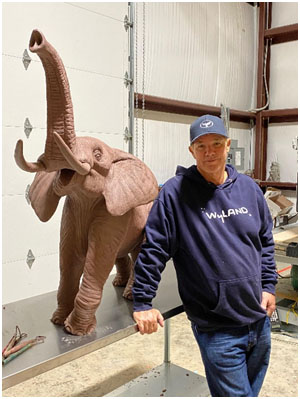 Wyland with elephant bronze sculpture in the making